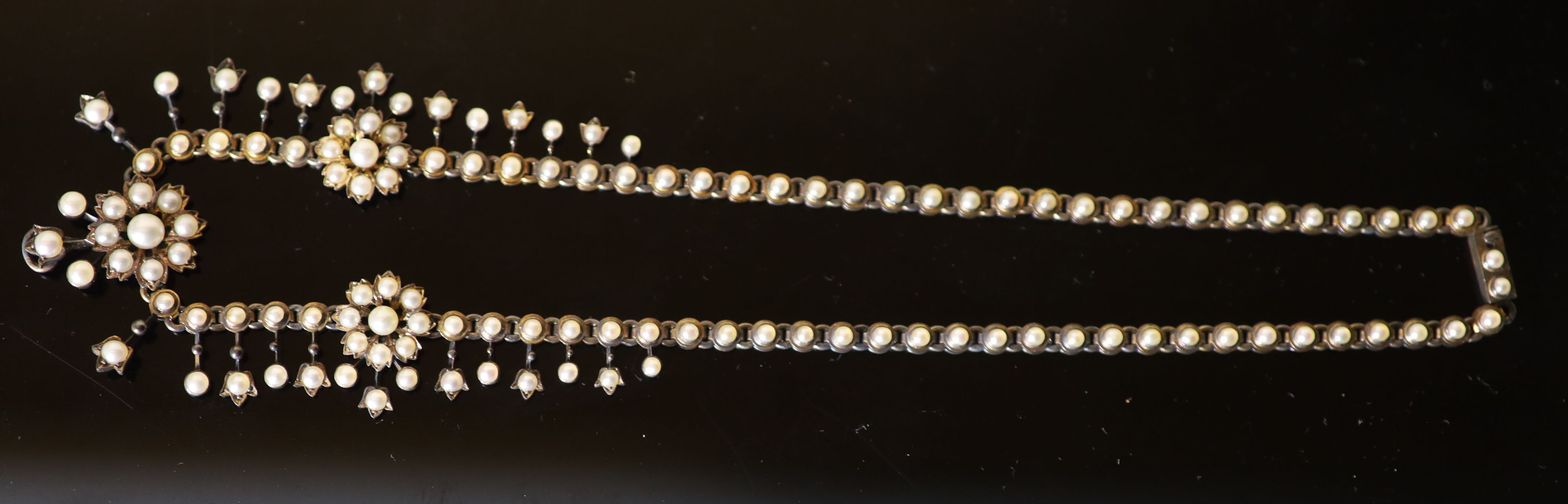An Edwardian gold and pearl set necklace,